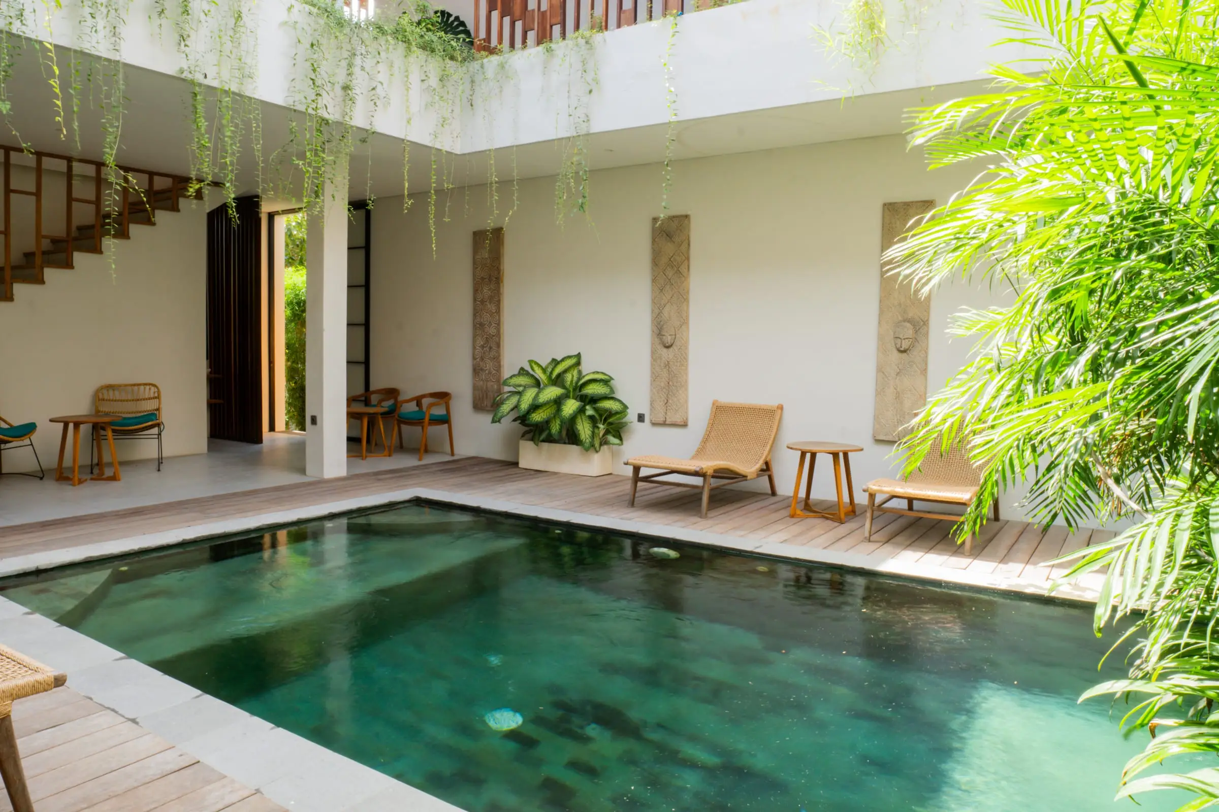 Pool in a villa courtyard with hanging plants